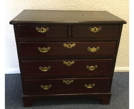 A Georgian chest of five drawers on bracket feet with brass handles. Est. £80 - £120.