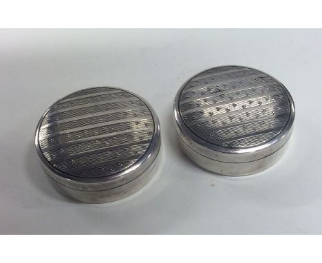 A good pair of silver pill boxes with engine turned decoration. Birmingham. By Mappin &amp; Webb. Approx. 20 grams. Est. £30 