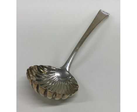 A Georgian silver ladle with fluted bowl. Approx. 39 grams. Est. £20 - £30.