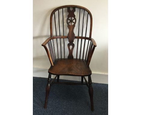 An Antique stick back Windsor chair of typical form. Est. £50 - £80.