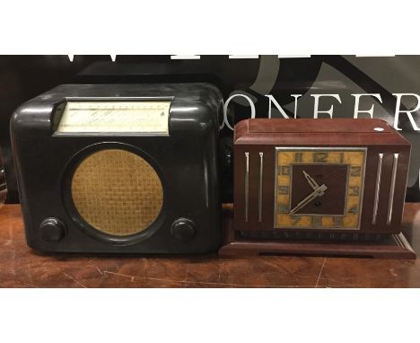 A Bakelite mantle clock of stylish form by Jaz. Est. £20 - £30.