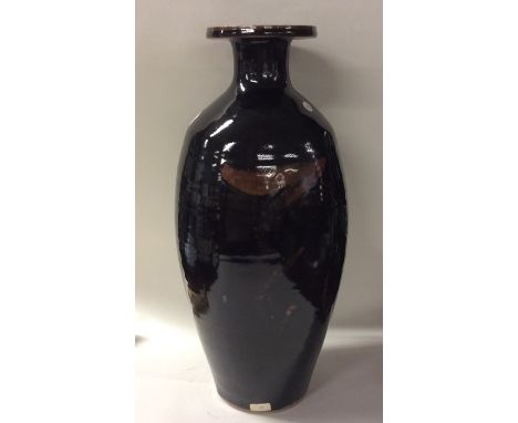 DAVID LEACH (British: 1911 - 2005): A massive 1970s baluster shaped stoneware pottery shoulder vase with flared neck in dark 