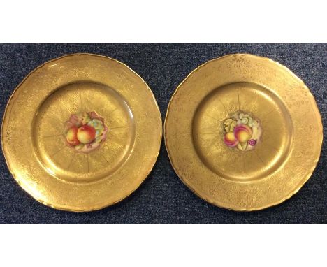 An attractive pair of Royal Worcester plates decorated with fruit. One painted by R Price; the other by C Hughes. Est. £50 - 