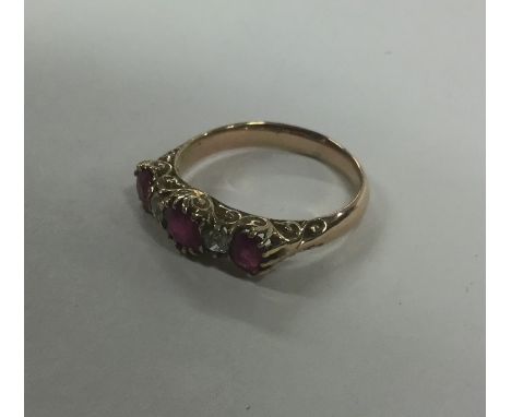 A good ruby and diamond five stone half hoop ring. Approx. 3.6 grams. Est. £500 - £600.