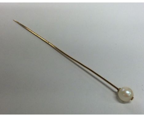 A 15 carat pearl mounted single stone stick pin. Approx. 1.8 grams. Est. £50 - £80.