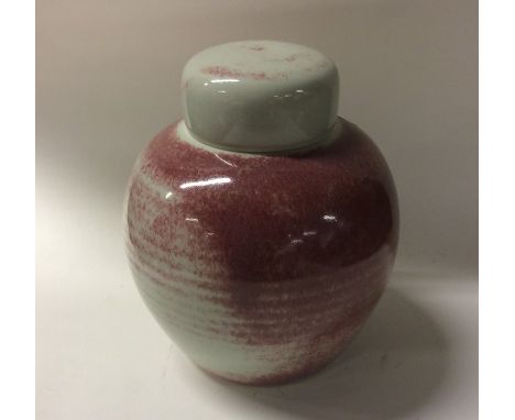 CHRISTINE-ANN RICHARDS (British: b. 1949): A pink glazed pottery tea caddy of baluster form with removable lid. Impressed ini