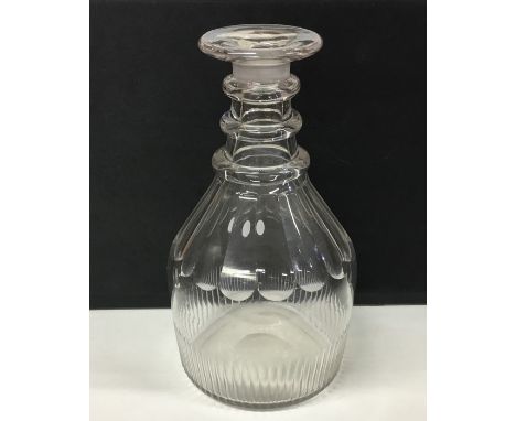 A Georgian glass decanter with fluted base. Approx. 21 cms high. Est. £30 - £50.