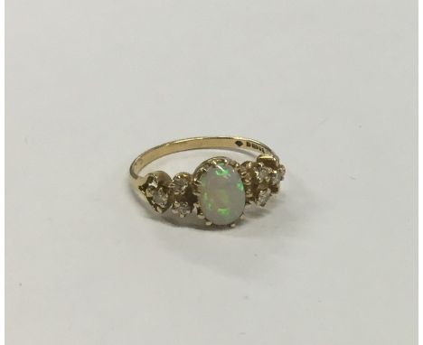 An Antique opal and diamond seven stone ring in claw mount. Approx. 2.9 grams. Est. £150 - £200.