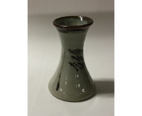 ROBERT TINNYUNT / JEREMY LEACH: A Lowerdown studio pottery glazed vase of tapering form with floral pattern to brown glazed r