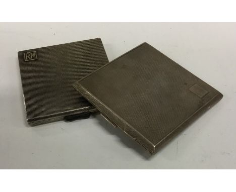 Two engine turned silver cigarette cases. Approx. 245 grams. Est. £40 - £60.