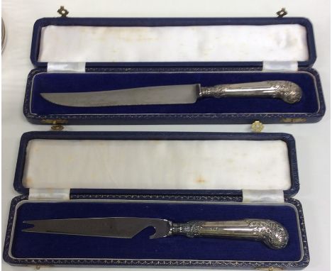 A cased silver cake knife together with one other. Est. £20 - £30.