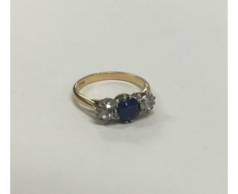 A sapphire and diamond five stone ring in 18 carat gold claw mount. Approx. 3.5 grams. Est. £250 - £300.