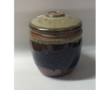 RICHARD BATTERHAM (British: b. 1936): A lidded glazed stoneware pot in dark celadon, green and brown. Apparently unmarked. St