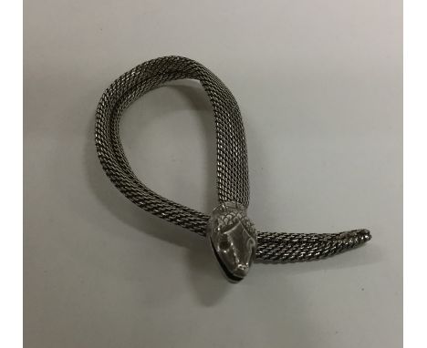 An Antique silver scarf clip in the form of a snake. Approx. 5.3 grams. Est. £20 - £30.