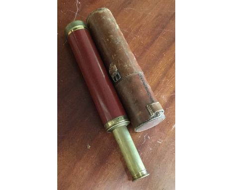 A large three drawer telescope contained within a leather case. By Dolland of London. Est. £30 - £50.