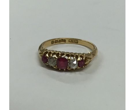 A Victorian 18 carat gold ruby and diamond ring. Approx. 3.5 grams. Est. £80 - £120.