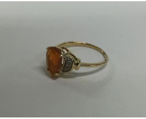 An 18 carat gold fire opal and diamond ring. Approx. 2.6 grams. Est. £50 - £60.