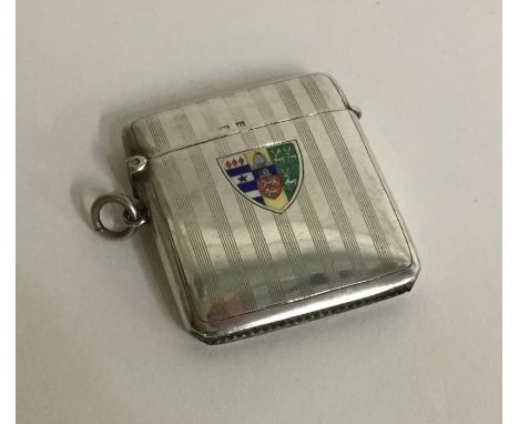 An unusual engine turned silver and enamelled vesta case. Birmingham. Approx. 39 grams. Est. £60 - £80.