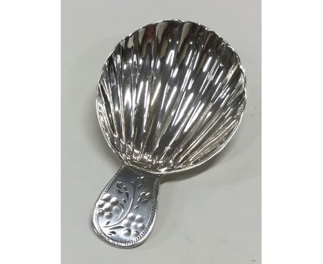 A good Georgian silver caddy spoon with fluted bowl. London. Approx. 7.5 grams. Est. £25 - £30.