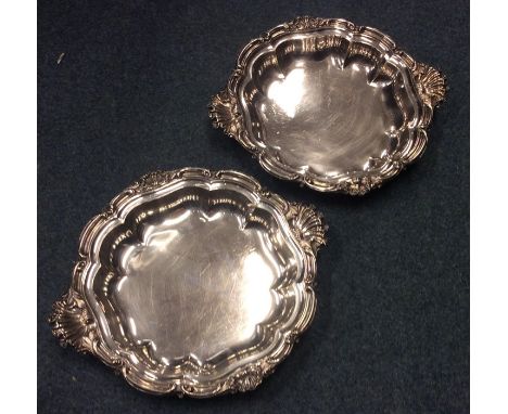 A pair of quality silver serving dishes attractively mounted with scrolls and flowers. London 1841. By Storr &amp; Roskill. A