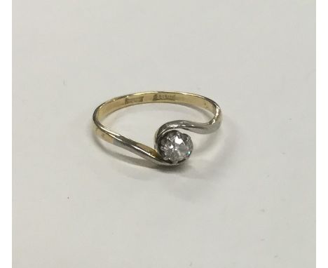 A good diamond single stone twist ring in 18 carat gold and platinum. Approx. 2.2 grams. Est. £100 - £150.