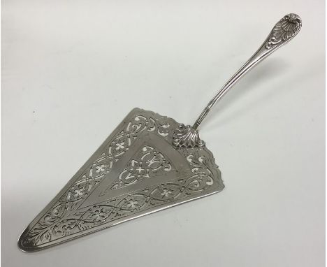 An attractive Georgian silver pudding trowel with pierced blade to reeded handle. London. By WT. Approx. 153 grams. Est. £500