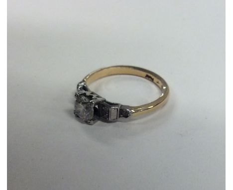 A good diamond single stone ring in platinum and gold setting. Approx. 2.8 grams. Est. £350 - £400.