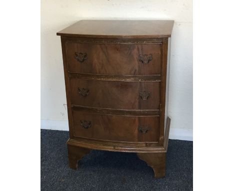 A bow front chest of three drawers to bracket feet. Est. £25 - £35.