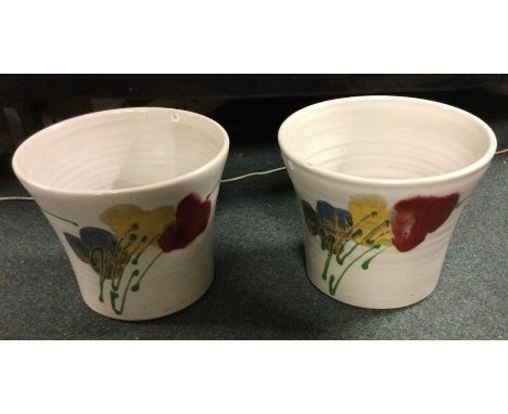 JANICE TCHALENKO (British: 1942 - 2018): A pair of large pottery planters of red poppy design. Approx. 23 cms tall each. Dart