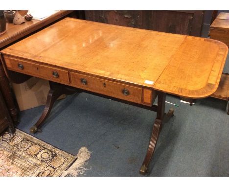 A good Georgian mahogany two drawer sofa table on tapering reeded supports with stretcher base. Est. £250 - £350.