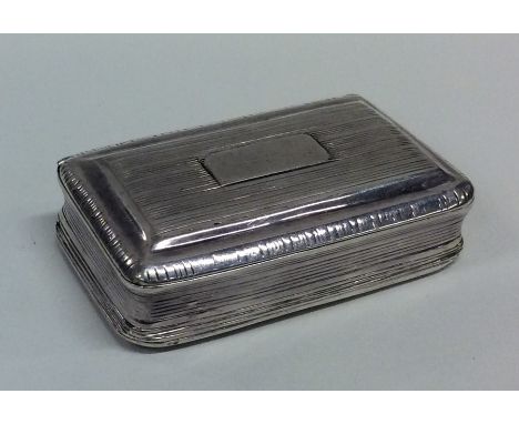 A Georgian silver hinged top snuff box with gilt interior. Birmingham. By TS. Approx. 62 grams. Est. £50 - £80.