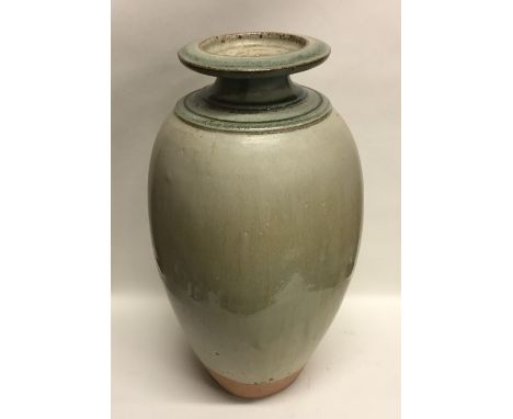 RICHARD BATTERHAM (British: b. 1936): A large tall green glazed stoneware pottery vase of baluster form. Exhibited in his 60t