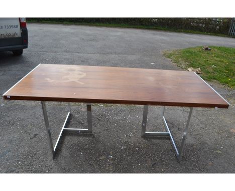 A Scandinavian rosewood refectory table raised on a pair of chrome tripod supports. 71cm H x 199cm W 90cm D