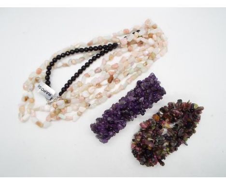 A 341.90ct Pink Opal, White Opal and Black Agate Sterling Silver Necklace with a length of 34 cm and and average metal weight