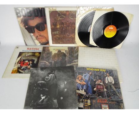12" vinyl records to include Pink Floyd, The Band, Bob Dylan and The Who.Condition Report: Pink Floyd, The Wall SHDW411
