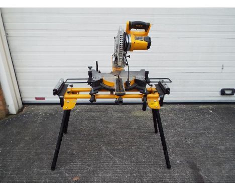 A JCB mitre saw, model MS-254SB and stand.