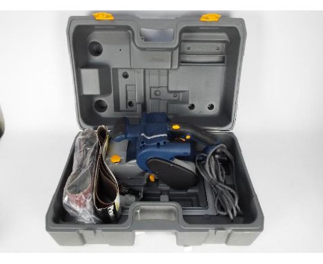 Ryobi - A 230v belt sander, model EBS 1310v, contained in carry case.