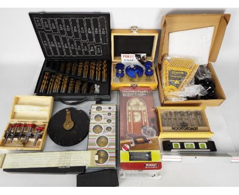 A quantity of tools to include a challenge Xtreme drill set in metal carry case, Blue Tornado wood working Rouka-key set, 7 p