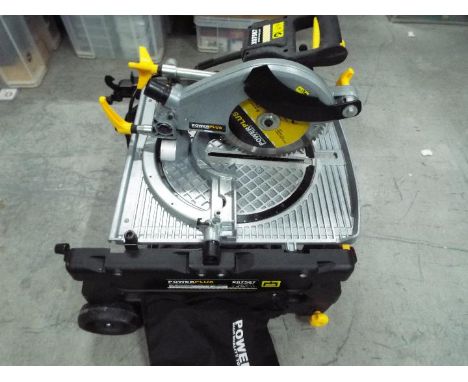 Power Plus - A flip over mitre / table saw, model number X07587.