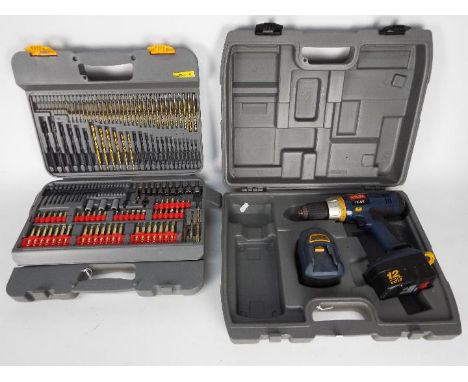 Ryobi - A cordless drill, model STP1201, contained in carry case and cased drill bit set. [2]