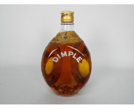 A vintage bottle of Dimple blended Scotch whisky with wire wrapping, no strength or capacity stated.