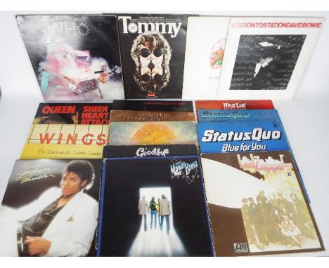 A collection of 12" vinyl records to include The Who, Led Zeppelin, Meat Loaf, Status Quo, Queen, David Bowie, Michael Jackso