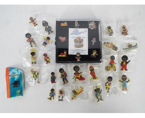 A collection of Robertson's Golly badges and a boxed set of Magic Roundabout badges.