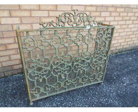 A metal fire screen approximately 86 cm x 133 cm.