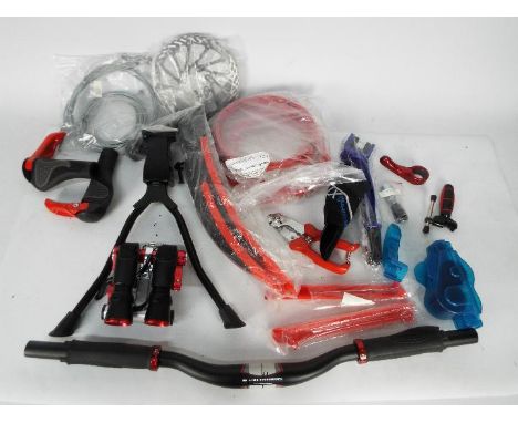 Cycling parts, tools, accessories to include lights, handle bars, cables and similar.