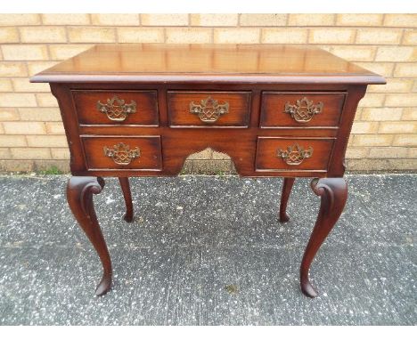 A small sideboard / console table raised on cabriole supports, approximately 75 cm x 77 cm x 45 cm