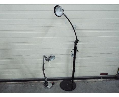 Two lamps, largest approximately 125 cm (h). [2]Condition Report: Small lamp working, large lamp untested as no 3 pin socket 