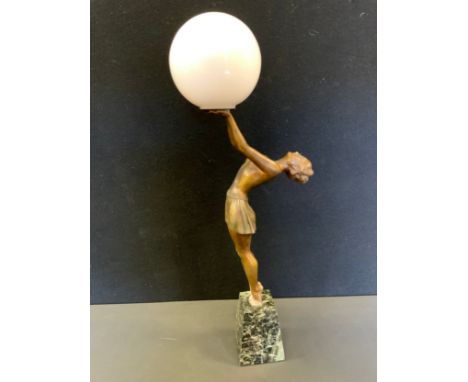 An Art Deco Spelter figural lamp base, a lady holding a globe aloft, after Balleste, 59.5cm high 