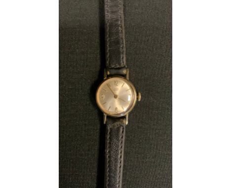 A 1960s Tudor Royal Rolex 9ct gold cased wristwatch, silvered dial, Arabic numerals and block baton markers, manual movement,