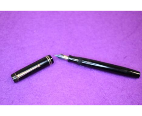 A Parker Duofold button fill fountain pen in black with two bands to cap, having a Parker Duofold B nib. Approx 12.4cm